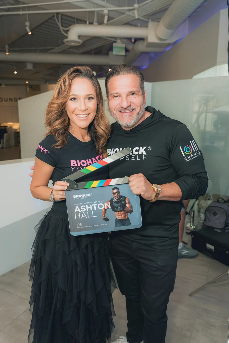 Guests holding the Biohack Yourself magazine at a launch event