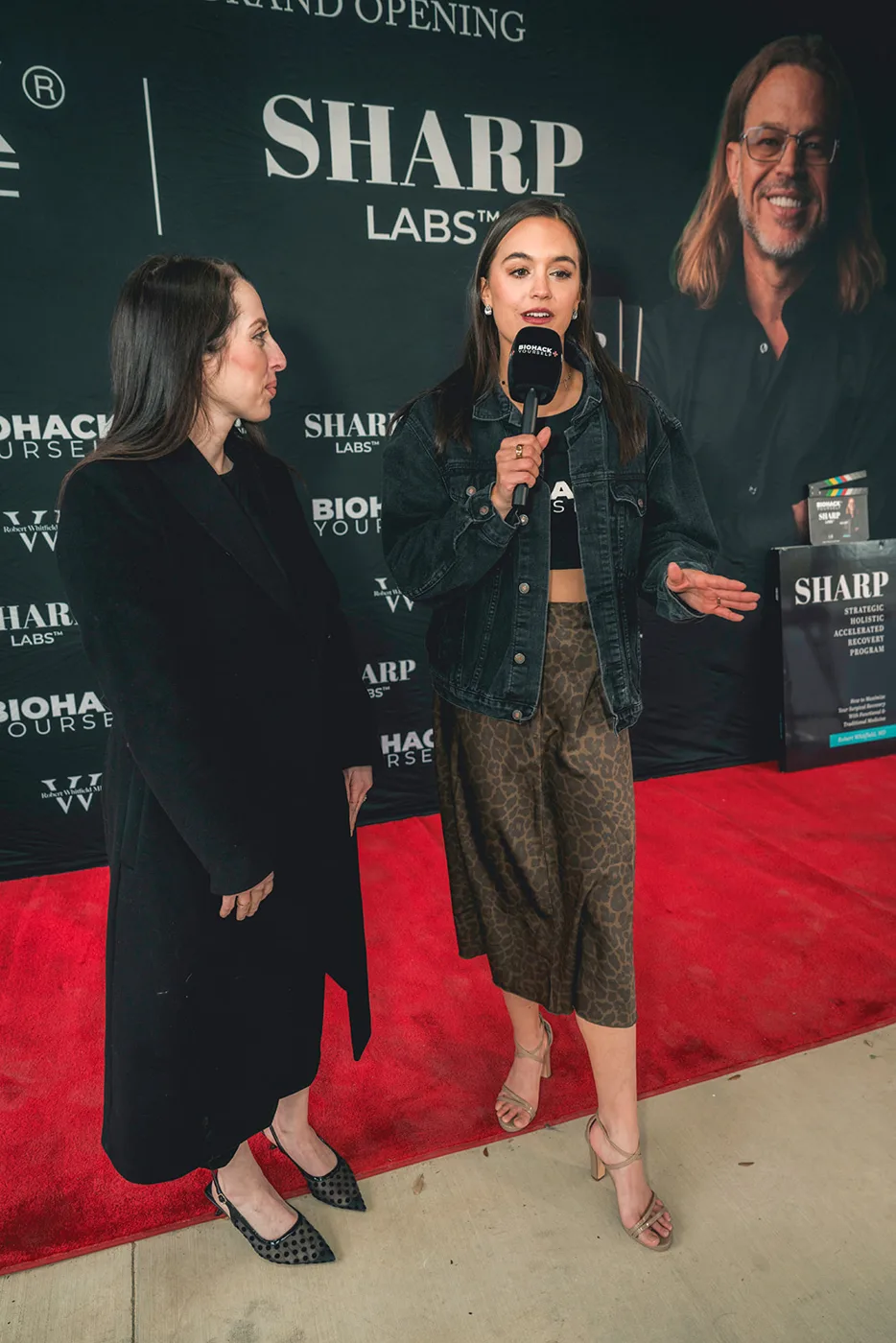Two Biohack Yourself journalists interviewing at a client event